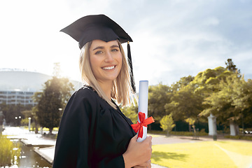 Image showing Woman, student and portrait smile of graduate with achievement in higher education. Happy female academic smiling in graduation holding certificate, qualification or degree for university scholarship