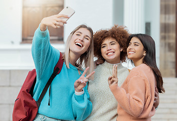 Image showing Women group, peace selfie and students with hug at college campus for goals, diversity or social media. Gen z woman, happy photo and smartphone for embrace, smile and study at university for success