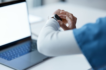 Image showing Watch, healthcare and time with a woman nurse working late at night on a laptop in the hospital. Medical, smartwatch and overtime with a female medicine professional at work on a computer in a clinic