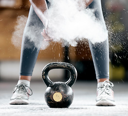 Image showing Fitness, chalk or legs by a kettlebell for training, workout or exercise with dust or powder for hand grip. Body builder, mindset or healthy athlete with a heavy weight, motivation or focus at gym