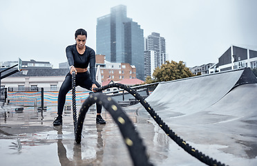 Image showing Fitness, workout and black woman with rope in city for cardio exercise, bodybuilder training and sports. Wellness, motivation and female athlete focus with gear for strong muscles, power and energy