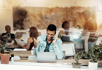 Image showing Creative man, phone and laptop at cafe with smile for communication, networking or conversation. Happy male freelancer smiling for call, discussion or startup on smartphone at coffee shop restaurant