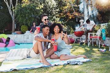 Image showing Friends, party and picnic in summer, selfie and fun together for break, relax and smile outdoor, playful or bonding. Young people, men or woman with smartphone, share picture or celebration in garden