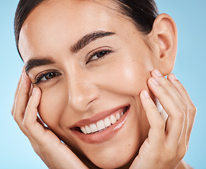 Image showing Woman, skincare and beauty in closeup studio portrait with smile, happy or excited for cosmetic wellness. Model, natural skin glow or happiness for cosmetics, wellness or aesthetic by blue background