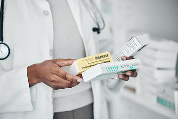 Image showing Pharmacy, healthcare and hands with pills, medicine and and medication for prescription in clinic. Wellness, pharmaceutical service and black woman with product box for drugs, vitamins and treatment