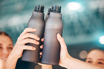 Image showing Hands, fitness and cheers with bottle water for team training, exercise or workout achievement in sports. Hand of sport group celebration touching bottles for drinking, hydration or winning in unity