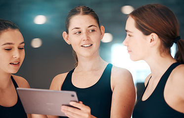 Image showing Sports, tablet and team talking, workout plan and research for routine, training and exercise in gym. Women, female athletes or healthy girls with device, conversation or online schedule for practice