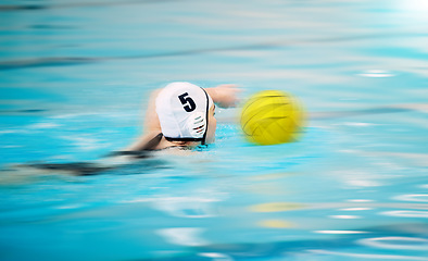 Image showing Sports, water polo and athlete swimming with a ball for a competition, exercise or hobby. Fitness, blur motion and swimmer training to play a professional sport game or match in a indoor pool.