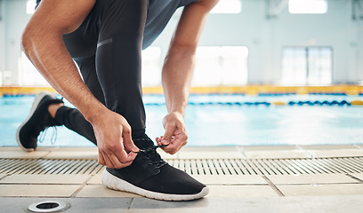 Image showing Fitness, shoes and man getting ready for training, exercise or running with sports sneakers, fashion and energy. Feet of an athlete, runner or person tying his laces for cardio or workout motivation