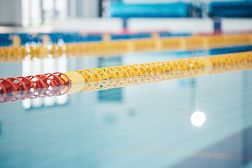 Image showing Pool, lanes in water for competition or racing lines for fitness or underwater sports empty with reflection. Exercise, workout and fresh, clear swim training arena lanes for swimming race with nobody