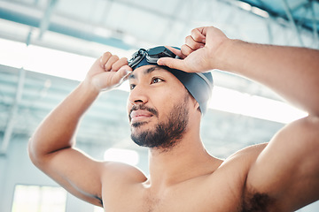 Image showing Swimming athlete, man and start race, fitness and exercise at pool, motivation and active lifestyle. Water sports, determination and face with workout, training and health with wellness in sport