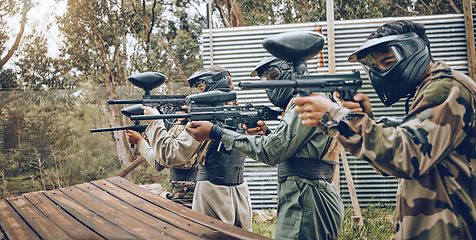 Image showing Team, paintball and target practice at shooting range in preparation for extreme sports match or game outdoors. Group of people, soldiers or army aiming to shoot for training before sport competition