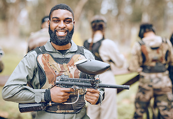 Image showing Paintball, gun and portrait of black man with smile ready for game, match and shooting battle outdoors. Extreme sports, adventure and male in camouflage, military clothes and action gear for arena