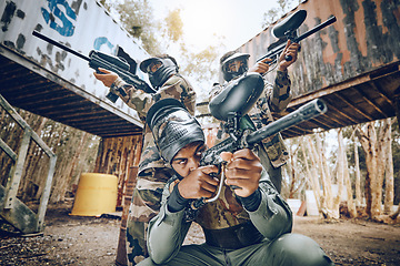 Image showing Paintball teamwork, shooting together and war game with vision, mask or tactical strategy for safety in competition. Military training, team building and group with weapon, combat and friends outdoor