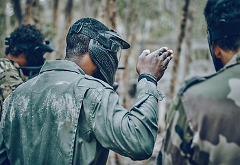 Image showing Training, paintball and man with hand sign for planning, strategy and plan of action outdoor. Military, men and hands by guy leading team in sports, shooting and intense target practice together
