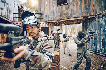 Image showing Paintball, teamwork and soldier group together for military, army and field game training. Exercise, fitness and target shooting of a man with battlefield players in a sports event outdoor with focus