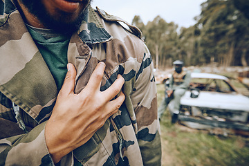 Image showing Paintball, camouflage and man at a match, competition or extreme sports training on a battlefield. Fitness, hand and male athlete or soldier with a military outfit for a fun outdoor game or practice.