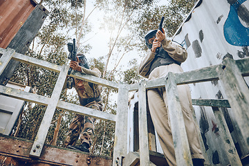 Image showing Paintball, teamwork people and gun target, shooting and games in war, adventure or military training. Focus, army and fitness sports person or man in safety gear for battlefield, action and warrior