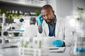 Image showing Headache, tired and scientist man in plants test laboratory on tablet pharmaceutical research or data results. Mental health, fatigue or burnout african science person thinking, stress or risk report