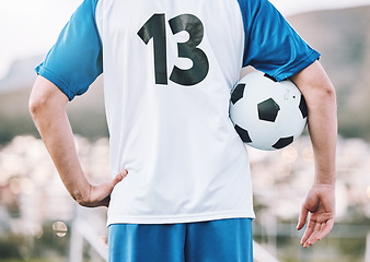 Image showing Back, soccer and man with ball, training and ready for competition, wellness and healthy lifestyle. Football, male athlete and player prepare for match, practice and fitness for cardio and endurance