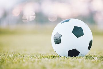 Image showing Soccer, ball and field ready for game time or match start in sports, athletics or tournament in the outdoors. Round sphere object with pentagon shape spots on green grass for playing sport on mockup