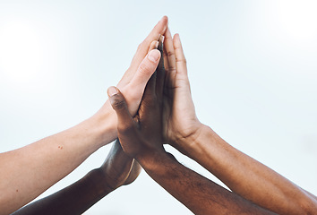 Image showing Sports, teamwork and hands high five for support, motivation and community with blue sky background. Collaboration, team building and group of players ready for game success, training and celebration