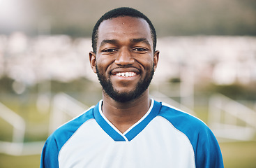 Image showing Sports, smile and portrait of soccer player on field with happy face and motivation for winning game in Africa. Confident, proud and black man at professional football competition or training match.