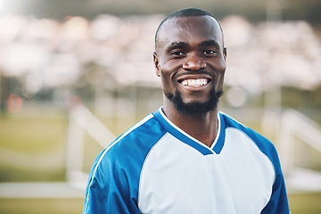 Image showing Sports, football and portrait of black man with smile on field and motivation for winning game in Africa. Confident, proud and face of happy professional soccer player at exercise or training match.