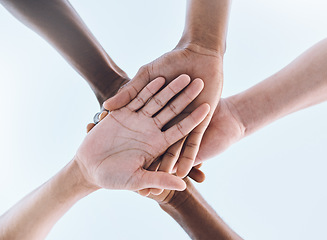 Image showing Sports, teamwork and stack of hands for support, motivation and community with blue sky. Collaboration, team building and group of people ready for success in game, fitness and training outdoors