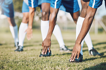 Image showing Man, soccer players and stretching legs before sports game, match or start on outdoor field. Group of men in team warm up stretch preparation for fitness training or football practice on green grass