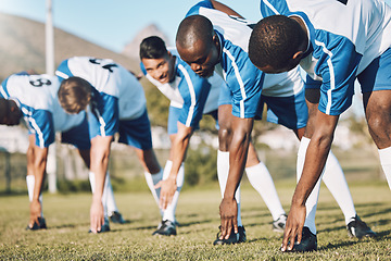 Image showing Soccer, sports and warm up with a team outdoor on a field getting ready together for a competitive game. Football, fitness and stretching with a male sport group of friends on a pitch before a match