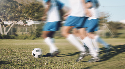 Image showing Men, football team and running fast on field with motion blur for training, exercise and teamwork in sunshine. Group, soccer and dribbling together with speed for workout, strategy and sports tactics