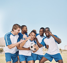 Image showing Soccer, team portrait and men celebrate winning at sports competition or game with teamwork on field. Football champion group excited for celebration of goal, performance and fitness achievement