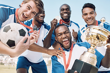 Image showing Soccer, trophy and men team winning portrait at sports competition or game with teamwork on a field. Football champion group people with medal or prize for goal, performance and fitness achievement