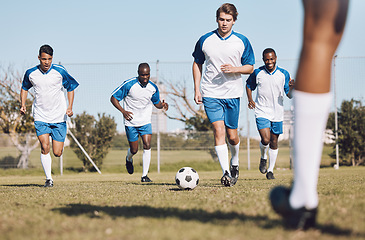 Image showing Soccer, ball and men team running during sports competition, training or game with teamwork. Football group people on a grass field for a goal, cardio performance and fitness achievement outdoor