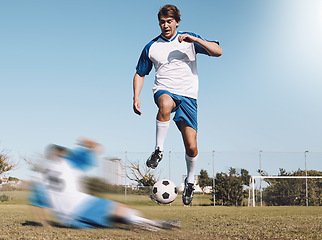 Image showing Soccer, tackle and motion blur with a sports man running on a field during a competitive game or training. Football, fitness or health and a male athlete or player on a pitch with an opponent