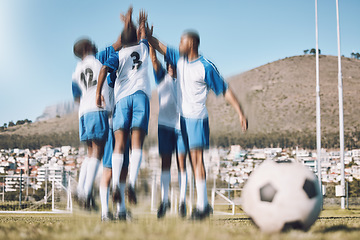 Image showing Soccer men, high five and men celebrate winning at sports competition or game with teamwork on a field. Football champion group people happy celebration for goal, performance and fitness achievement