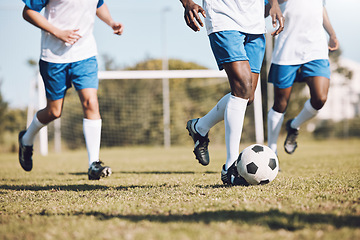 Image showing Sports, running and men with a football on a field for training, competition and professional game. Teamwork, exercise and soccer players at a park for cardio, fitness action and workout in Brazil