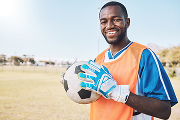 Image showing Soccer, goal keeper and portrait of black man with ball and smile on face, motivation for winning game in Africa. Confident, proud and happy professional football player at exercise or training match