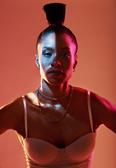 Image showing Portrait, beauty and kaleidoscope with a model black woman in studio on a neon background for fashion. Art, makeup and style with an attractive young female posing indoor for culture or cosmetics