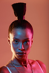 Image showing Portrait, makeup and neon with a model black woman in studio on a kaleidoscope background for beauty. Art, fashion and style with an attractive young female posing indoor for culture or cosmetics