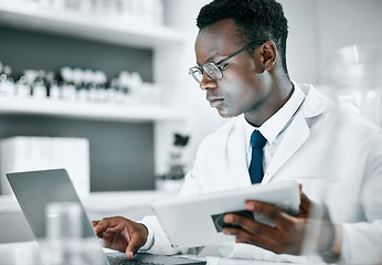 Image showing Science, research and black man with tablet and laptop for medical report, analytics and test results. Biotechnology, healthcare and scientist with digital tech for data, lab study and innovation