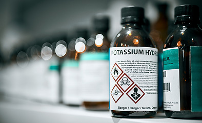 Image showing Science, pharmaceutical chemical and bottle on shelf in laboratory for medical research. Healthcare, medicine and innovation in manufacturing of poison antidote with danger on warning label in lab.