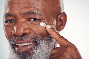 Image showing Face cream, skincare and senior man in studio for wellness, beauty and grooming against grey background. Facial, skin and elderly model relax with luxury, cosmetics and wrinkle product while isolated