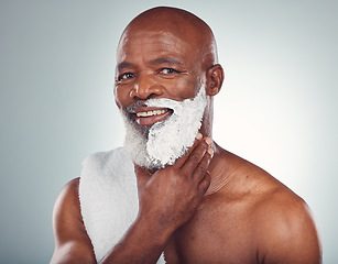 Image showing Black man, face and shaving cream, smile in portrait for beauty and grooming isolated on studio background. Facial hair removal, happy elderly person and hygiene with skincare, glow and wellness