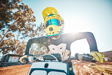 Image showing Motorcross, motorcycle and man in helmet for sports challenge, offroad race and desert sunshine. Driver, bike and gear for dirt track competition, motorbike performance and action on adventure course