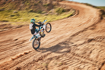 Image showing Motorcycle athlete, dirtbike and motion blur for sports on sand trail for freedom. Driver, cycling and offroad competition, motorbike performance and adventure course for fast action, speed and risk