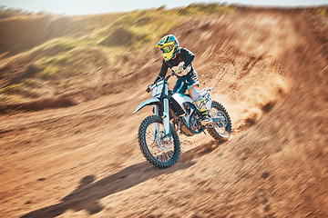 Image showing Sport, motorcycle and person driving in a desert for fitness, training and extreme sports in nature. Biking, motorbike and athletic practice stunt, speed and adrenaline in sand, exercise and freedom