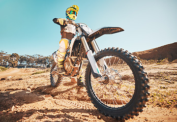 Image showing Motorcross, motorcyclist and man in sports gear for challenge, offroad race and desert rally. Driver, bike and ready for dirt track competition, motorbike performance and action on adventure course