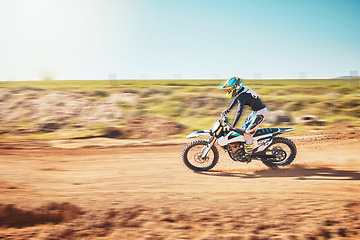 Image showing Motorbike, motorcross and speed on sand trail with power, sunshine and sports rally. Driver, motorcycle and man travel on dirt track, adventure course and action for freedom, performance and talent